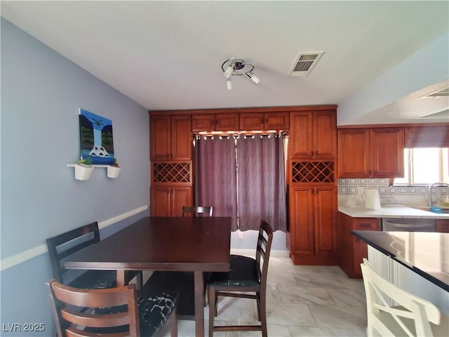 dining room featuring marble finish floor and visible vents