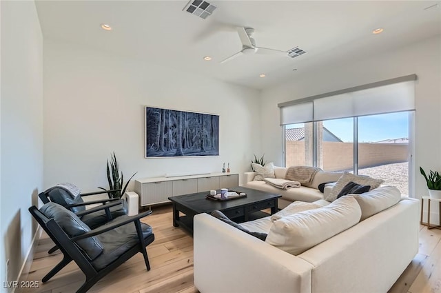 living area with visible vents, recessed lighting, and light wood-type flooring