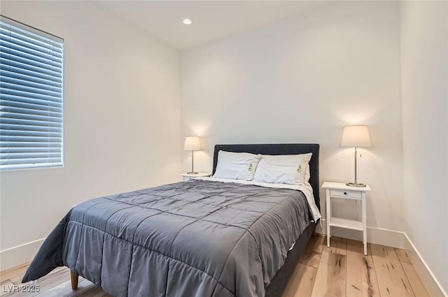 bedroom featuring recessed lighting, baseboards, and wood finished floors