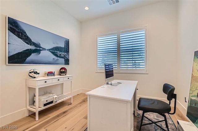 office space with recessed lighting, visible vents, baseboards, and light wood-style flooring