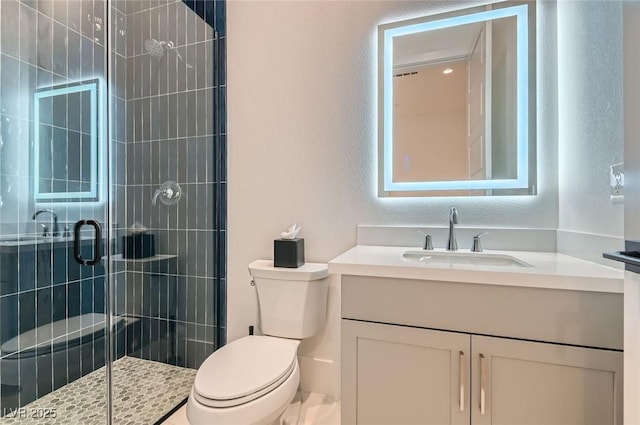 full bathroom with a shower stall, toilet, and vanity