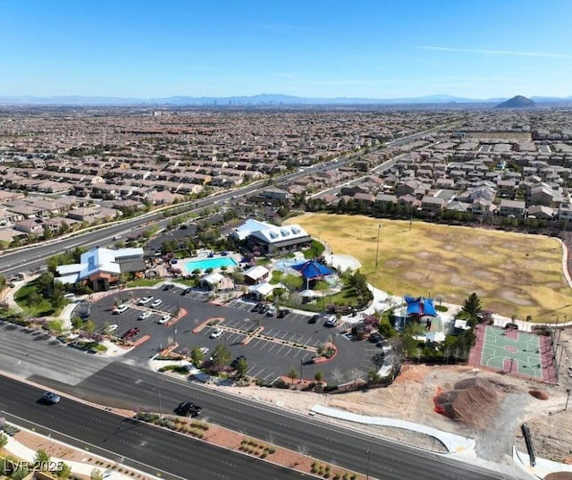 birds eye view of property with a mountain view and a residential view