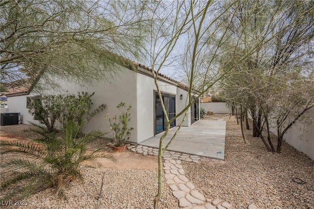 view of yard featuring cooling unit, a patio, and fence