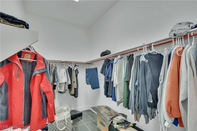 spacious closet with tile patterned floors