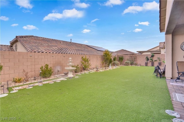 view of yard with a fenced backyard