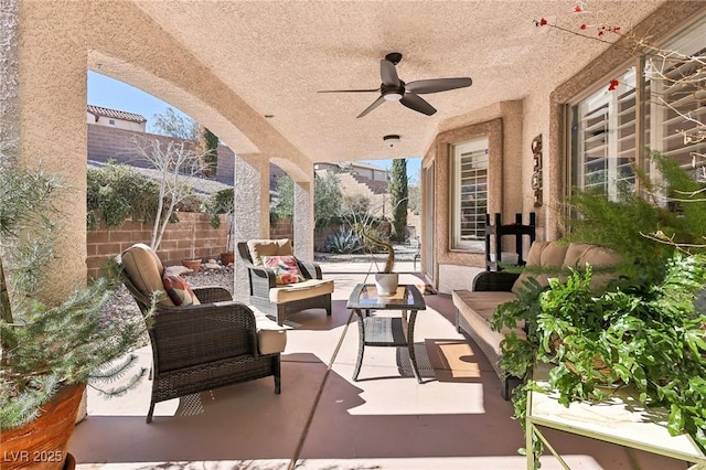 view of patio / terrace featuring fence private yard, ceiling fan, and an outdoor hangout area