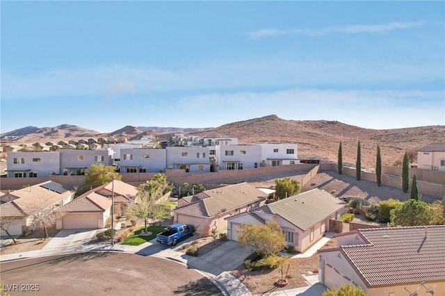 birds eye view of property featuring a mountain view and a residential view