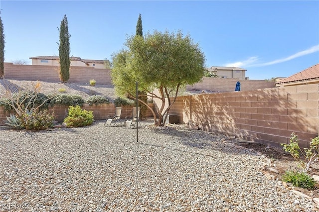 view of yard with a fenced backyard