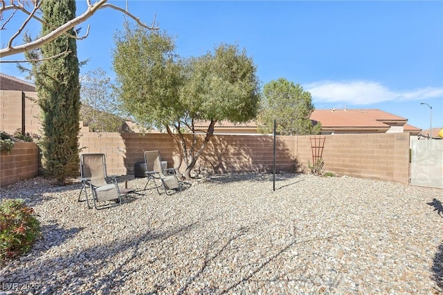 view of yard featuring a patio and a fenced backyard