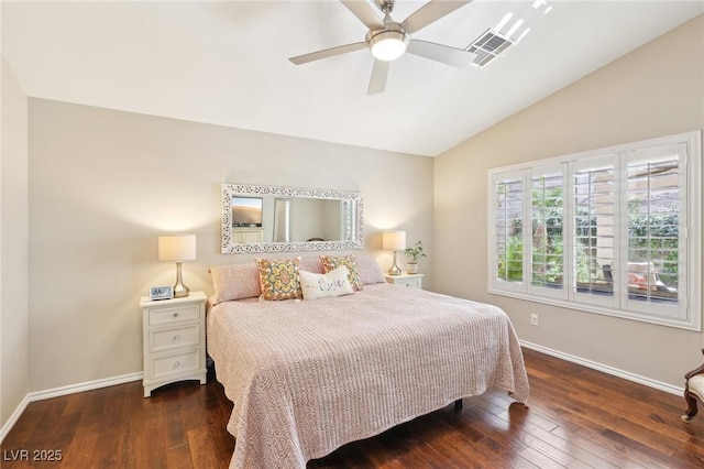 bedroom featuring hardwood / wood-style flooring, baseboards, visible vents, and vaulted ceiling