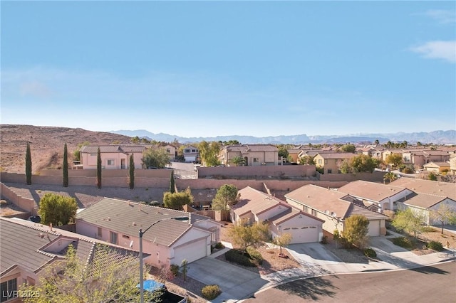 birds eye view of property with a residential view and a mountain view