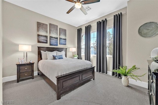 bedroom featuring light colored carpet, visible vents, ceiling fan, and baseboards