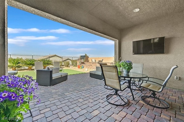 view of patio with outdoor dining area and a fenced backyard