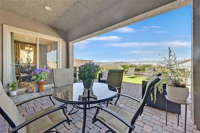 balcony with a patio and outdoor dining space