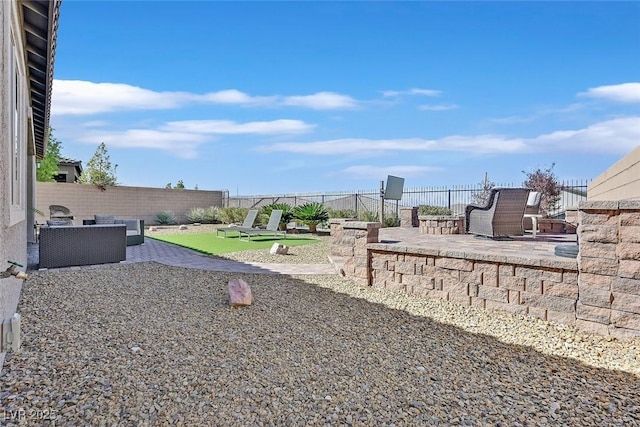 view of yard featuring a patio area and a fenced backyard