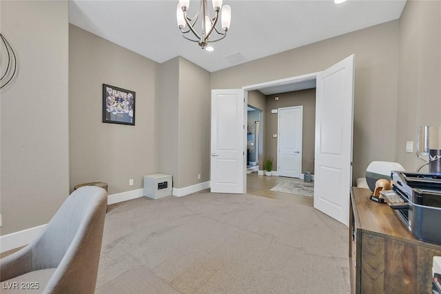 office with carpet, a notable chandelier, and baseboards