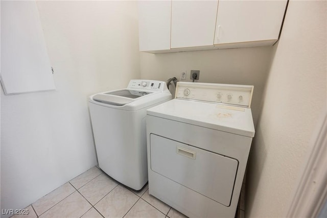 6284 Pinewood Ave, Las Vegas, NV 89103 - laundry room with cabinet space, light tile patterned flooring, and independent washer and dryer