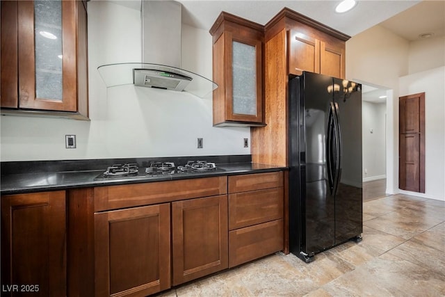6284 Pinewood Ave, Las Vegas, NV 89103 - kitchen featuring black appliances, wall chimney exhaust hood, dark countertops, and glass insert cabinets