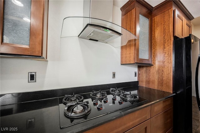 6284 Pinewood Ave, Las Vegas, NV 89103 - kitchen with brown cabinets, dark countertops, glass insert cabinets, wall chimney range hood, and black appliances