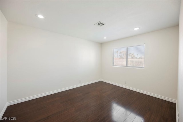 6284 Pinewood Ave, Las Vegas, NV 89103 - spare room featuring dark wood-type flooring, recessed lighting, visible vents, and baseboards