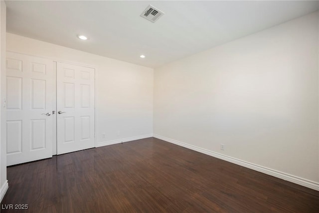 6284 Pinewood Ave, Las Vegas, NV 89103 - unfurnished room with dark wood-type flooring, recessed lighting, visible vents, and baseboards