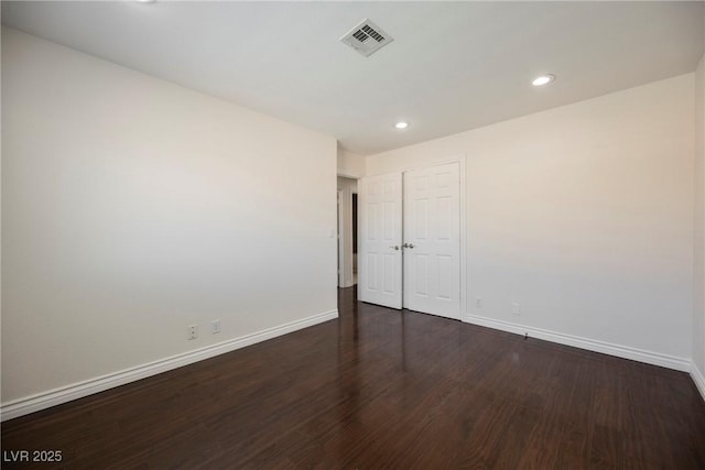 6284 Pinewood Ave, Las Vegas, NV 89103 - unfurnished room featuring dark wood-style flooring, recessed lighting, visible vents, and baseboards
