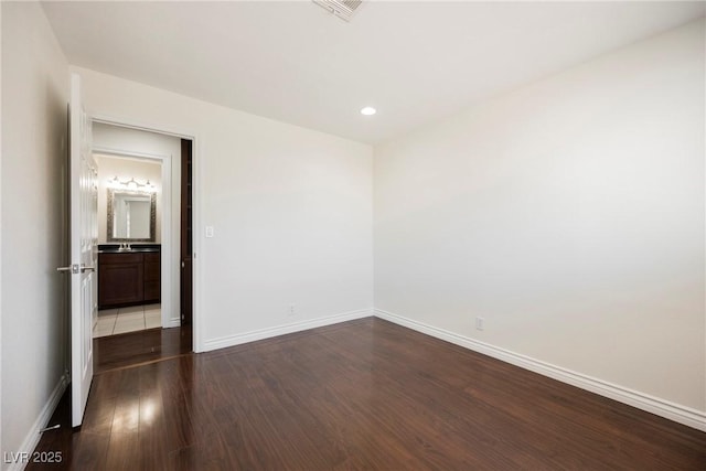 6284 Pinewood Ave, Las Vegas, NV 89103 - unfurnished bedroom with dark wood-style flooring, recessed lighting, visible vents, and baseboards