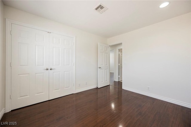 6284 Pinewood Ave, Las Vegas, NV 89103 - unfurnished bedroom featuring dark wood-style flooring, recessed lighting, a closet, visible vents, and baseboards