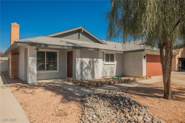 6284 Pinewood Ave, Las Vegas, NV 89103 - single story home featuring a chimney, stucco siding, a shingled roof, an attached garage, and driveway