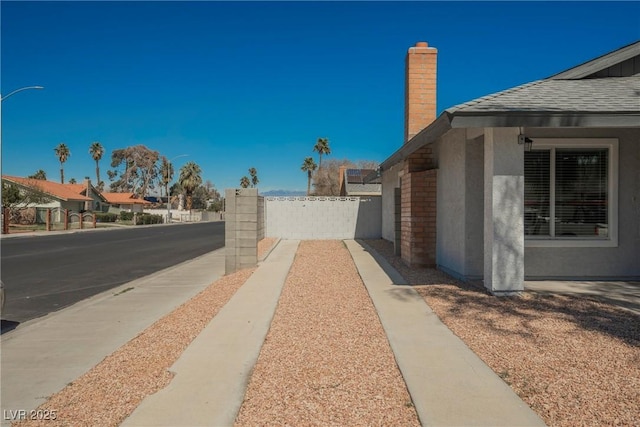 6284 Pinewood Ave, Las Vegas, NV 89103 - exterior space featuring sidewalks and street lights