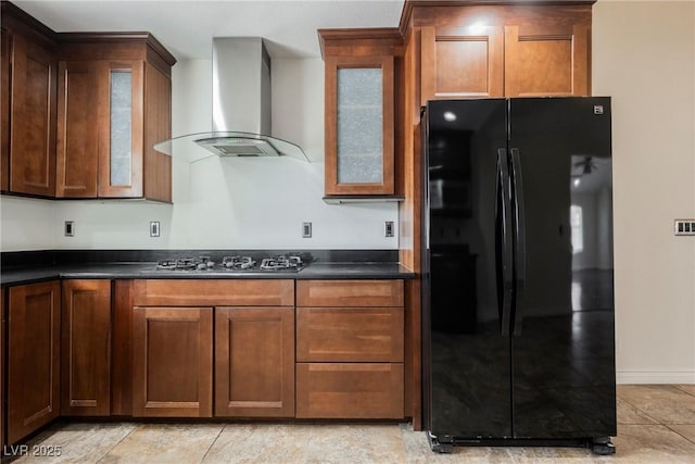 6284 Pinewood Ave, Las Vegas, NV 89103 - kitchen with freestanding refrigerator, dark countertops, wall chimney range hood, and gas stovetop
