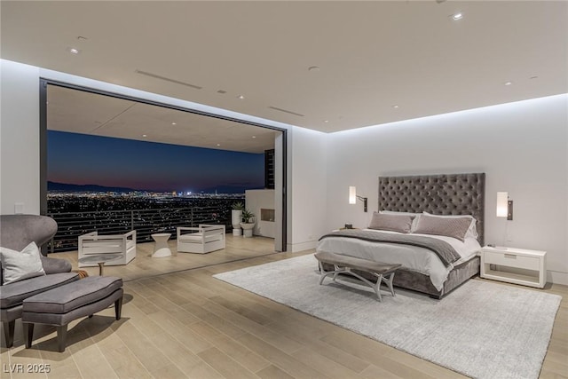 bedroom with light wood-type flooring