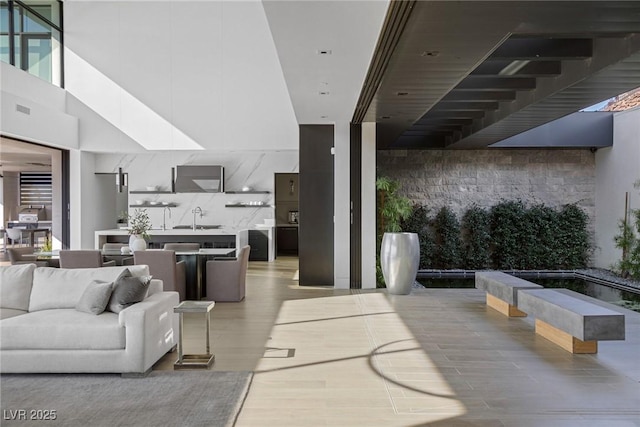 living room featuring visible vents and light wood-style floors