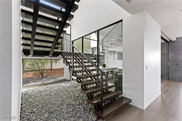 stairway featuring wood finished floors