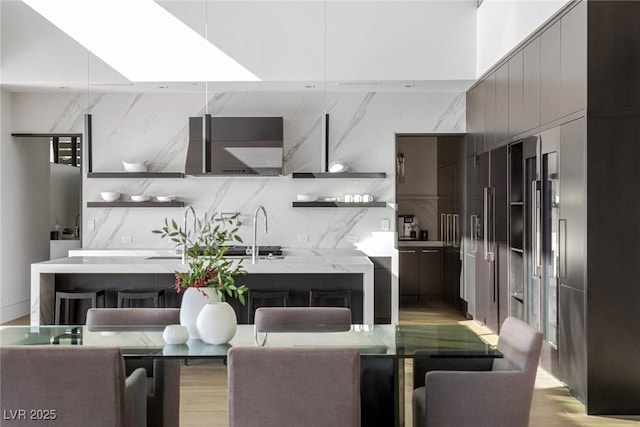 dining area featuring light wood-style floors