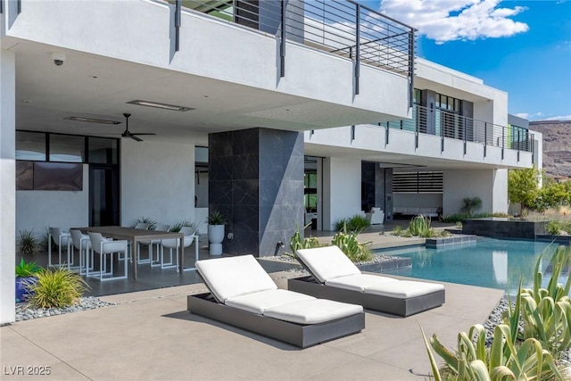 pool featuring a patio area and a ceiling fan