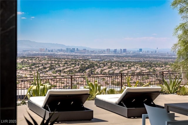 balcony featuring a city view and outdoor lounge area