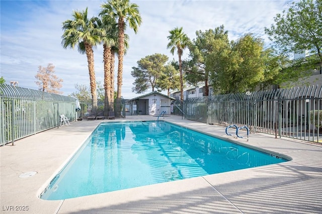 pool with fence and a patio