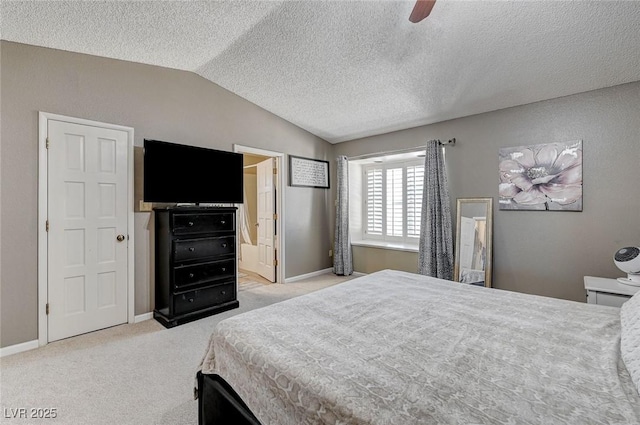 bedroom with lofted ceiling, light carpet, ceiling fan, a textured ceiling, and baseboards