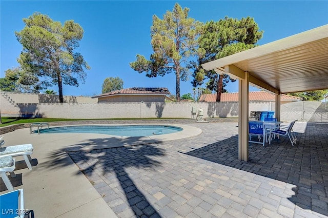 view of pool featuring a fenced backyard, a fenced in pool, and a patio