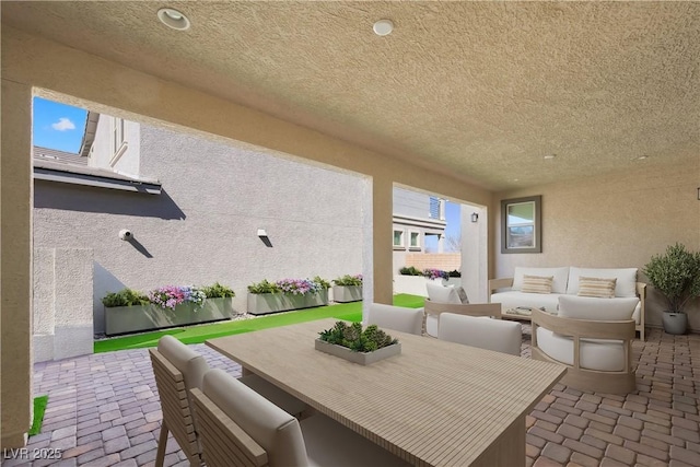 view of patio with fence and an outdoor living space