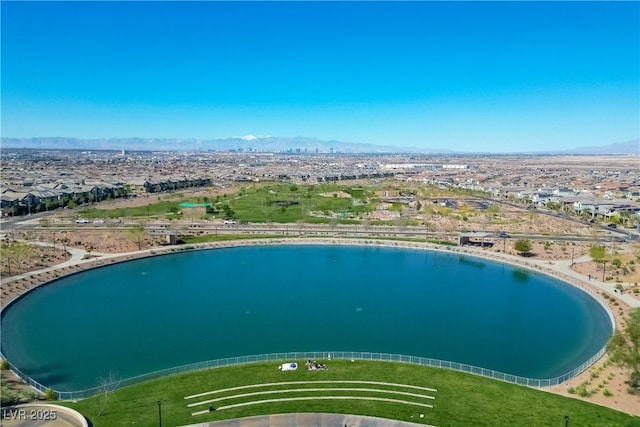 view of swimming pool with a water and mountain view