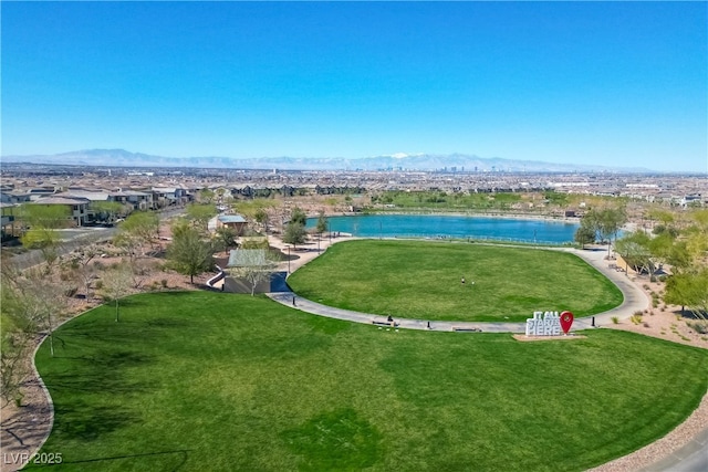 aerial view featuring a water and mountain view