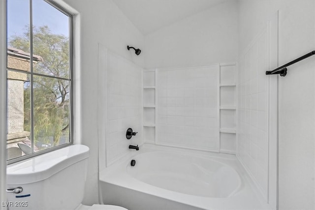 full bath featuring shower / bathtub combination, plenty of natural light, and toilet