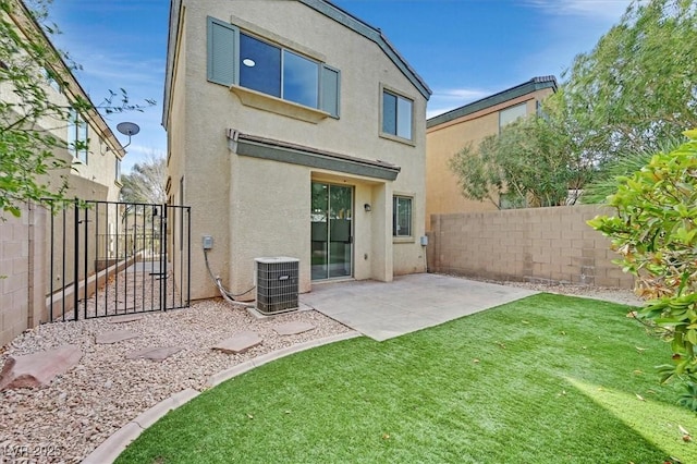 rear view of property featuring central AC, a patio area, a fenced backyard, and stucco siding