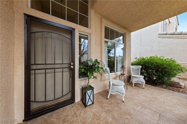 doorway to property with stucco siding