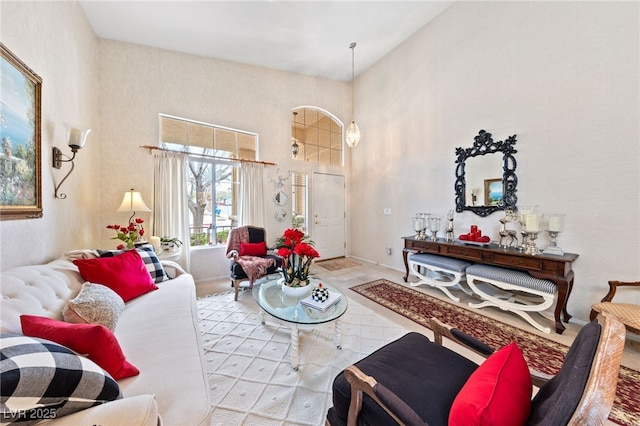 living area featuring a high ceiling