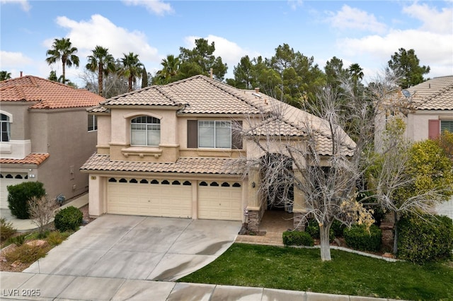 mediterranean / spanish-style home featuring a garage, a tile roof, driveway, and stucco siding