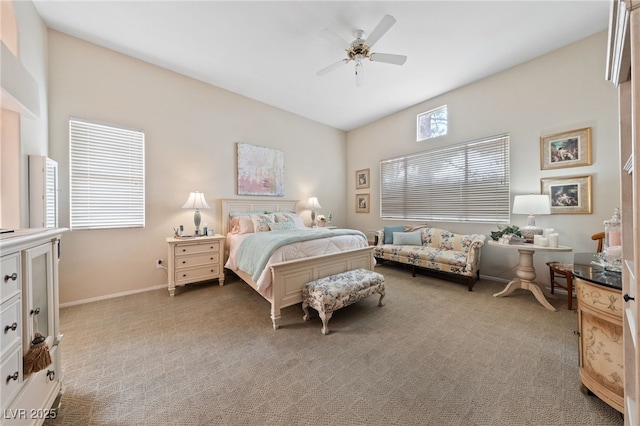 bedroom with baseboards, a ceiling fan, and light colored carpet