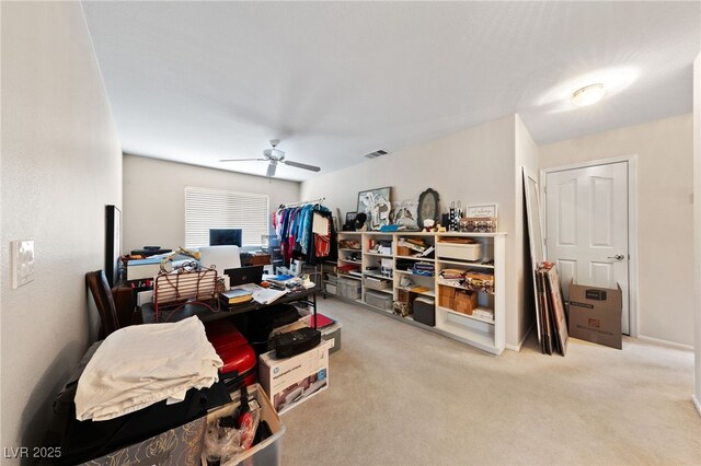 interior space with ceiling fan and visible vents